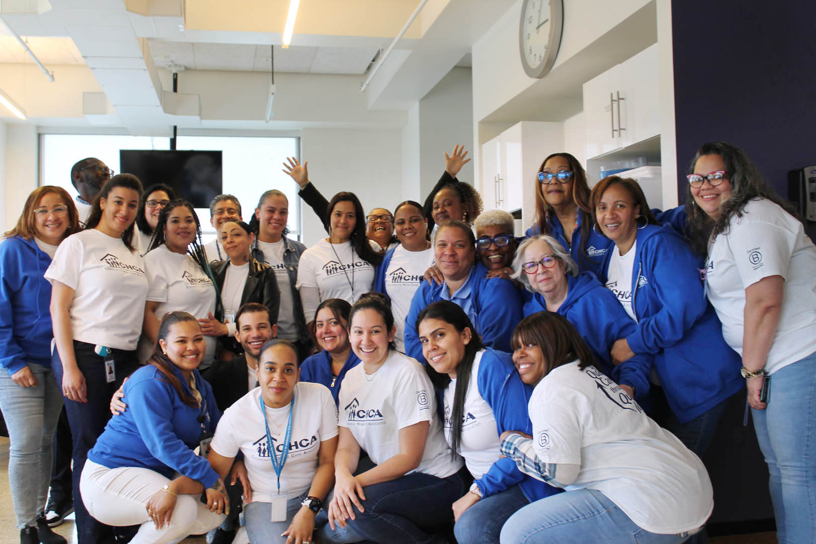 large group of CHCA staff posing for a group photo and smiling