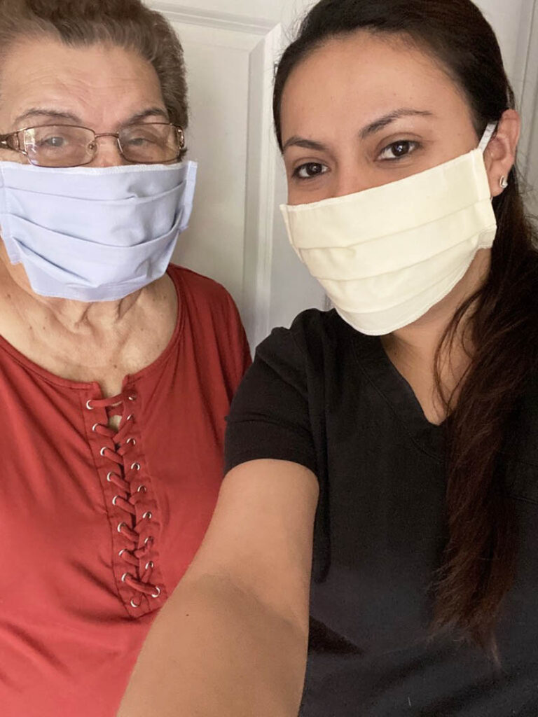 caregiver and client selfie with masks